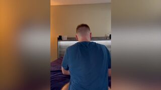 Coach helps guy with his back pain by stretching him out