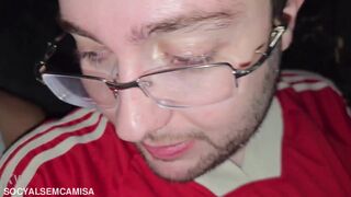 Gay nerd being used by two tops in the box of a gay porn cinema - COMPLETE ON RED - 11 image