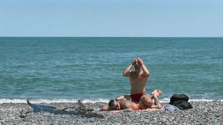 Kit Belove takes Falcon Al's massive cock in her oily ass on the beach & gets a raw and hard pounding