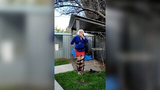 Daisy taped to a pole in back yard - 14 image